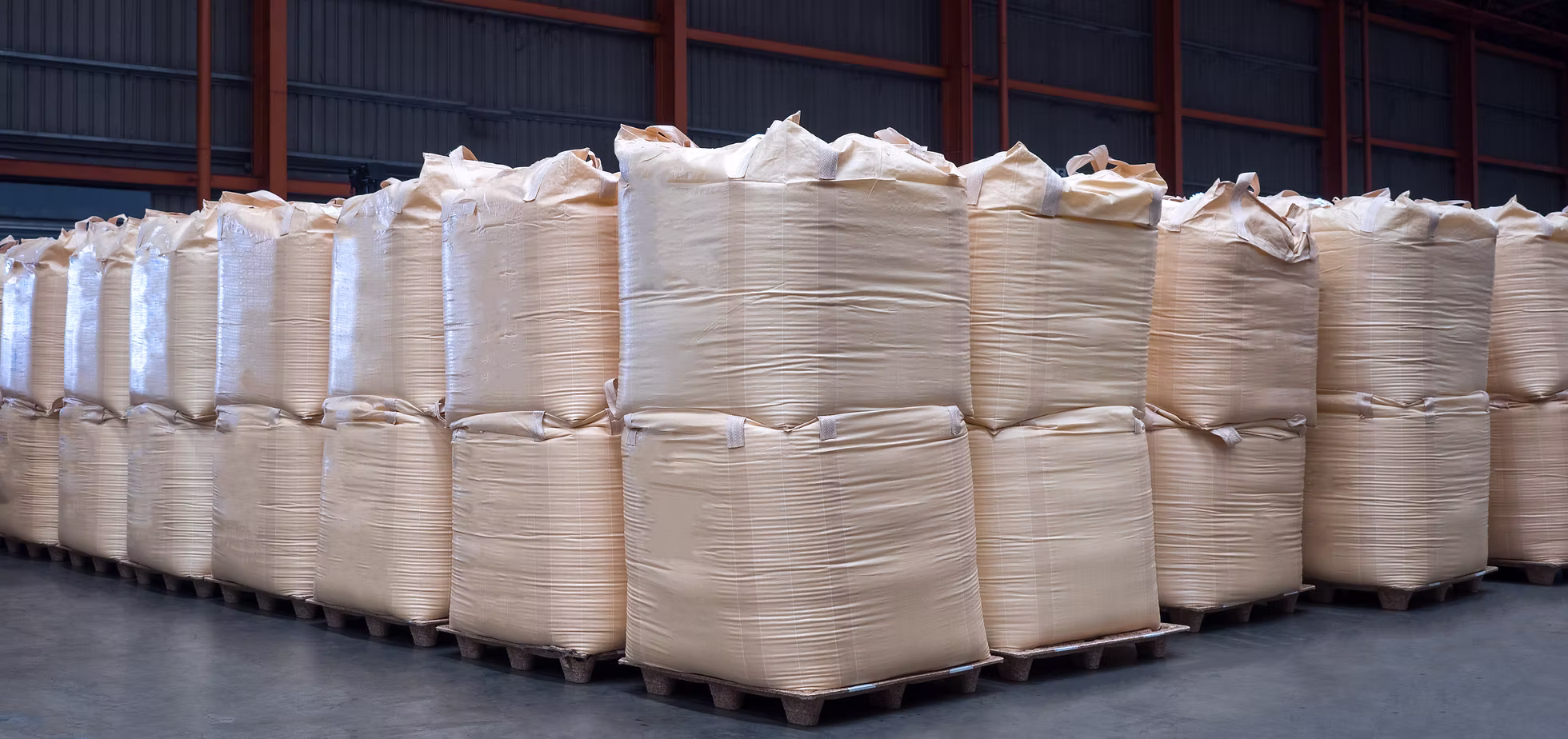 Rows of jumbo bags stored in the PSAgrimex JSC warehouse
